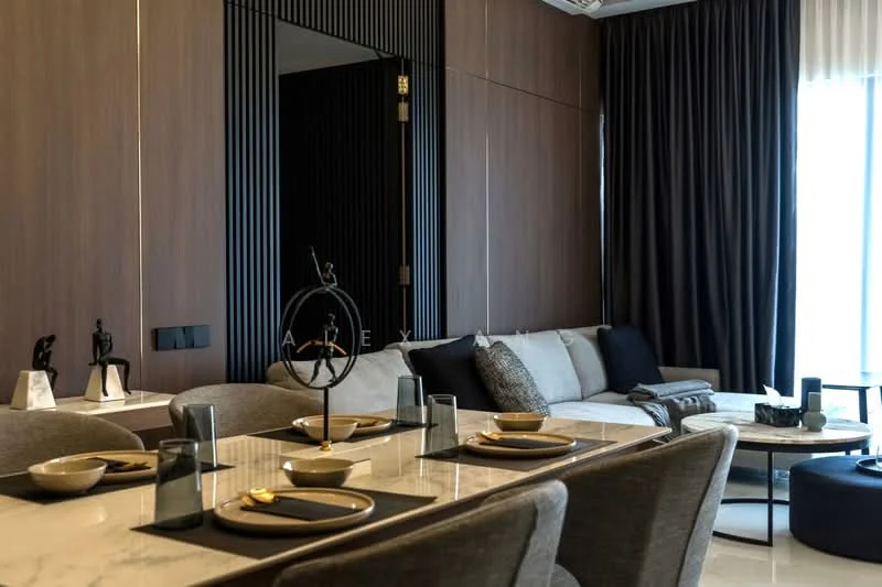 Dining features: marble dining table, upholstered dining chairs, black placemats, decorative table setting, dark wood paneling, floor-to-ceiling windows with sheer curtains, sofa in grey fabric, black coffee table, decorative sculpture, dark accent pillows; style: modern.