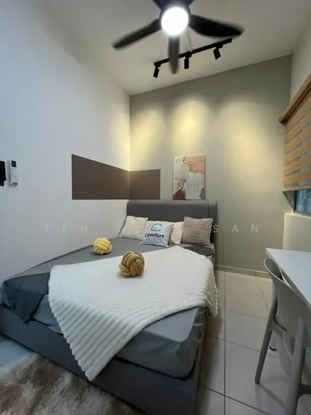Bedroom features: queen-size bed, upholstered headboard, white bedding, decorative throw pillows, 2 decorative cushions, wall-mounted artwork, grey accent wall, white painted walls, ceiling fan with light, window with roller blinds, white study desk, tile flooring; style: modern.