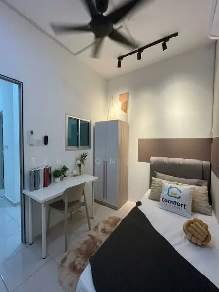 Bedroom features: single bed with white bedding, upholstered headboard in grey, study desk with chair, built-in wardrobe in light wood, white walls, recessed lighting, ceiling fan, decorative wall art, window with sheer curtains, area rug, throw pillows; style: modern.