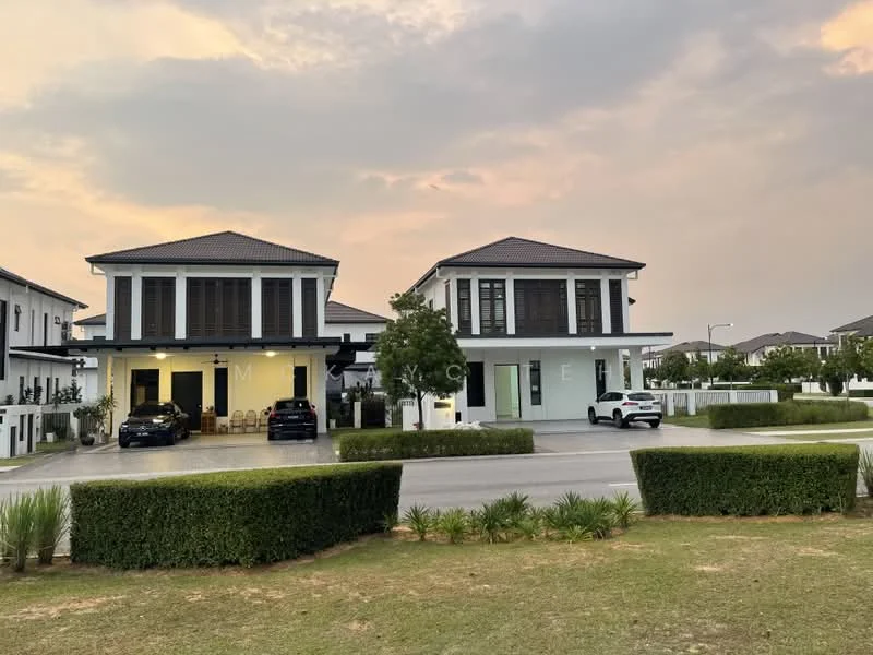 Exterior type: semi-detached house; features: two-storey structure, white painted facade, dark tiled roof, large windows with black frames, manicured lawn, hedge landscaping, driveway with parked car, porch area with seating, surrounding greenery, urban residential setting; style: modern.