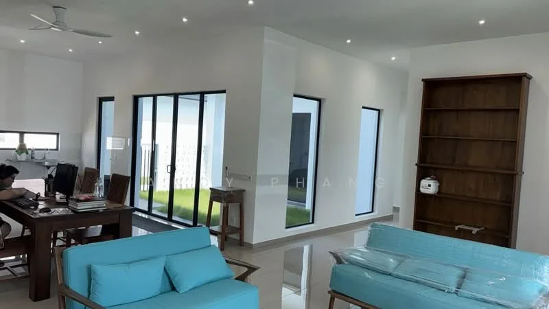 Living features: 3-seater fabric sofa in turquoise, coffee table, wall-mounted TV, ceiling fan, recessed downlights, large sliding glass doors, white painted walls, polished tile flooring, decorative shelving unit, area rug, open layout to dining area; style: modern; view: garden. Dining features: dining table, wooden dining chairs, large windows, white painted walls, polished tile flooring; style: modern; view: garden.