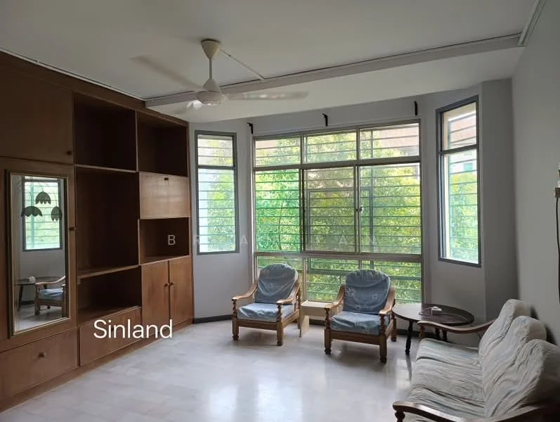 Living features: large windows with multiple panes, wooden shelving unit, two armchairs with cushions, small round side table, ceiling fan, light-colored flooring, neutral wall color, decorative wall art; style: modern; view: garden.