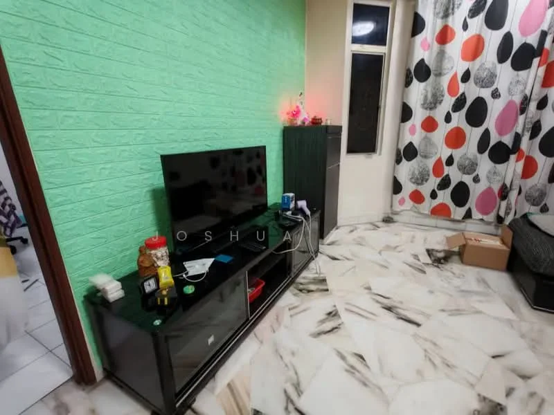 Living features: green accent wall with textured finish, white marble flooring with black veining, black TV console, flat-screen TV, decorative items on console, large window with sheer curtains, colorful patterned curtains, box on the floor; style: modern.
