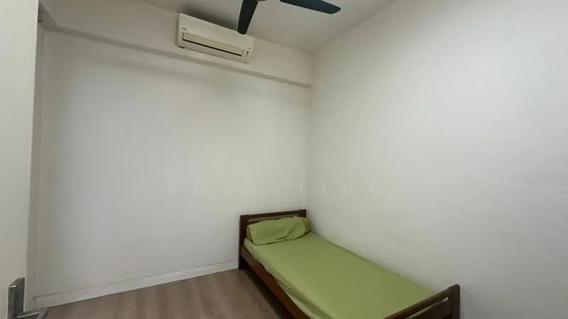 Bedroom features: single bed, green bed linen, white painted walls, wooden flooring, 1 wall-mounted split AC, ceiling fan, window with no visible treatment.