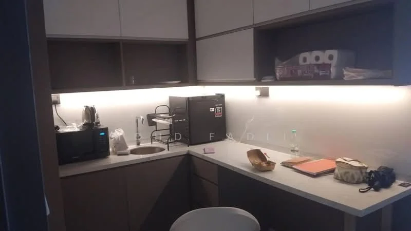 Kitchen features: single-bowl stainless-steel sink, chrome pull-down faucet, grey cabinetry, white countertop, built-in coffee machine, microwave, kitchen appliances, under-cabinet lighting, paper towel roll, notebooks, plastic container, white chair; style: modern.