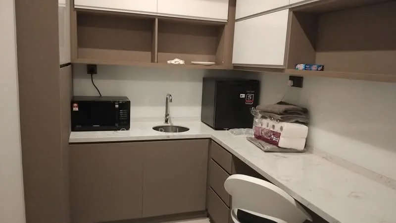 Laundry features: single-bowl stainless-steel sink, chrome faucet, microwave, black fridge, white countertop, brown cabinetry, open shelving, stacked towels, white chair; style: modern.