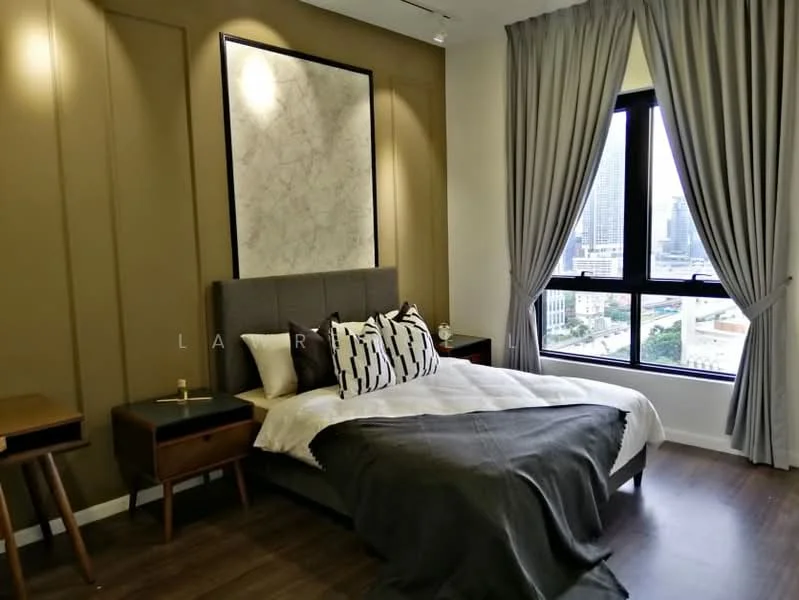 Bedroom features: king-size bed with grey upholstered headboard, white bedding with decorative pillows, wooden bedside table, table lamp on bedside table, floor-to-ceiling window, grey curtains, brown accent wall, wooden flooring, decorative wall art; style: modern; view: city.