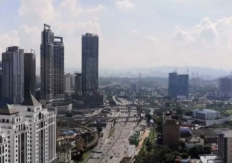 Exterior type: high-rise condominium; features: city skyline view, multiple high-rise buildings, urban landscape, highway visible, construction cranes in the background, green spaces visible, mixed-use development, modern architectural design; style: modern.