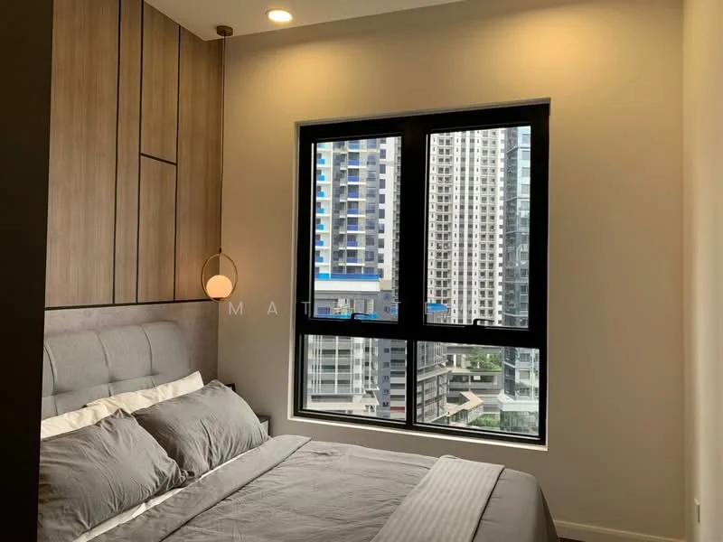 Bedroom features: king-size bed, upholstered headboard, grey bedding, wood panel accent wall, floor-to-ceiling windows, black window frames, city view, recessed downlights, pendant light, light grey walls, laminate flooring; style: modern; view: city.