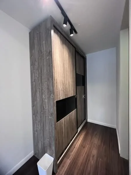 Room features: wooden cabinetry with a textured finish, dark wood paneling, built-in storage, track lighting, laminate flooring, white walls, waste bin; style: modern.
