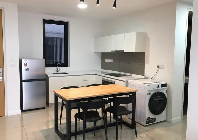 Kitchen features: white cabinetry, grey tile backsplash, stainless-steel fridge, single-bowl stainless-steel sink, chrome pull-down faucet, built-in oven, 4-burner gas hob, washing machine, wood dining table, 4 black dining chairs, ceramic tile flooring, recessed downlights, window with black frame; style: modern.
