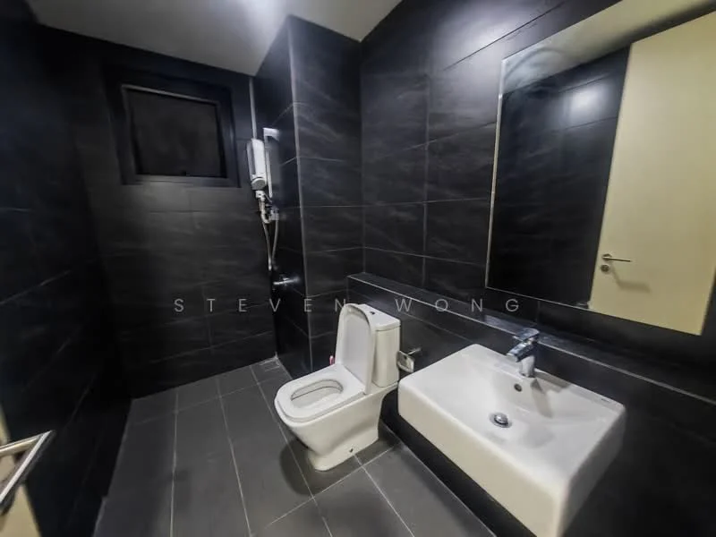 Bathroom features: black tiled walls, grey tiled flooring, one-piece toilet, single-sink vanity with integrated basin, chrome basin mixer faucet, framed mirror, shower with handheld showerhead, wall-mounted shower unit, window for natural light, neutral painted ceiling, door with modern handle; style: modern.