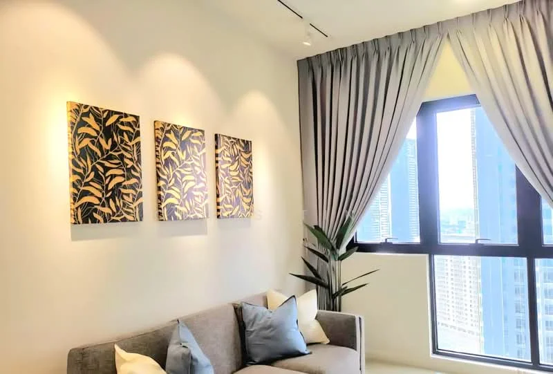 Living features: grey fabric sofa, decorative cushions in light blue and cream, framed artwork with botanical design, sheer curtains in light grey, floor-to-ceiling window, indoor plant, recessed downlights, white painted walls; style: modern; view: city.
