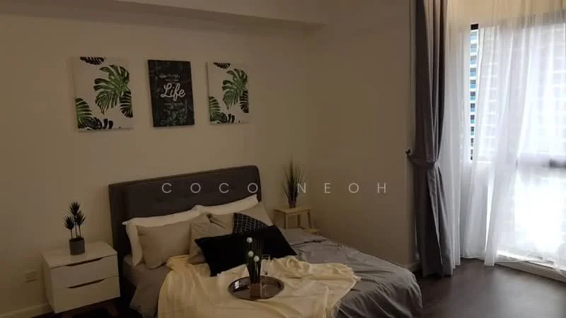 Bedroom features: king-size bed with grey upholstered headboard, white bedding with decorative throw, two bedside tables with drawers, table lamp on bedside table, framed artwork with tropical leaves, decorative plant on bedside table, light-colored curtains, large window with city view, wooden flooring, neutral wall color; style: modern; view: city.
