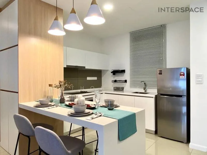 Kitchen features: white cabinetry, light wood accent cabinetry, grey countertop, stainless-steel fridge, built-in oven, 4-burner gas hob, single-bowl stainless-steel sink, chrome pull-down faucet, pendant lighting, window with blinds, dining table with 2 chairs, decorative vase with flowers, table setting with plates and cutlery; style: modern.