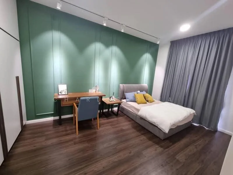 Bedroom features: green accent wall, white painted walls, laminate flooring, queen-size bed with grey upholstered headboard, white bedding, two decorative yellow pillows, wooden desk, blue chair, recessed lighting, floor-to-ceiling curtains in grey; style: modern.