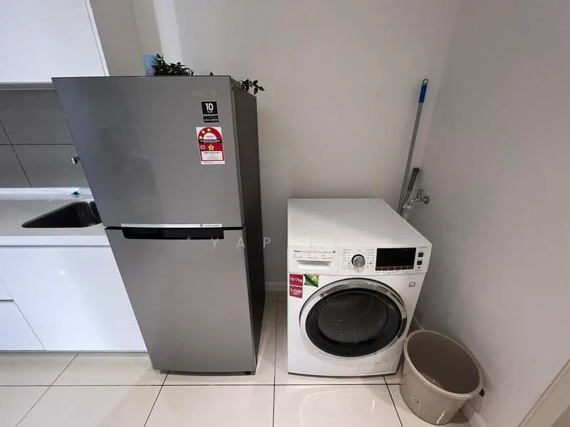 Laundry features: stainless-steel fridge, front-load washing machine, white laundry basket, grey cabinetry, white countertop, tile flooring, plant on shelf, cleaning supplies, sink; style: modern.