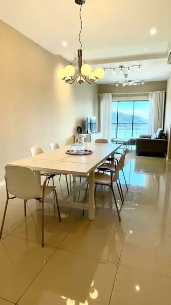 Dining features: white dining table, 8 dining chairs, chandelier with 5 bulbs, large windows with sheer curtains, polished ceramic tile flooring, light beige painted walls, ceiling with recessed lighting, wall-mounted air conditioning unit, sofa in living area visible in background, decorative centerpiece on table; style: modern; view: city.