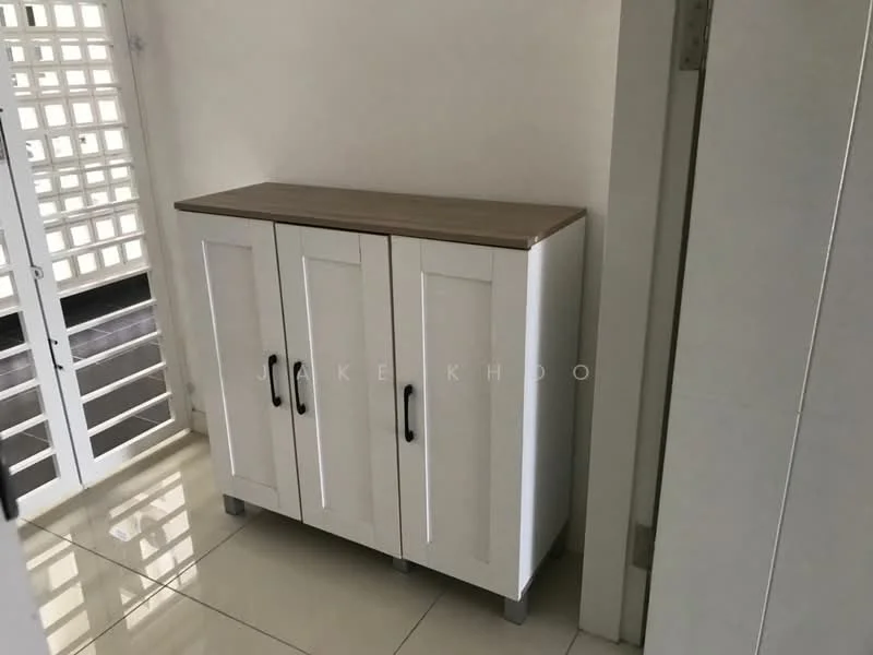Room features: white cabinet with three doors, wooden countertop, metal handles, glossy tile flooring, neutral wall color, visible door frame, light from window, minimalist design; style: modern.