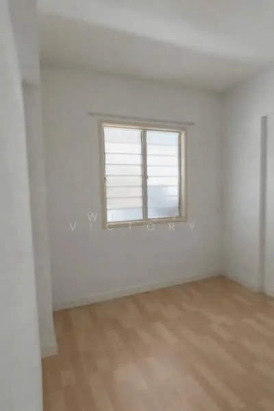 Room features: white painted walls, light wood flooring, single window with horizontal slats, no visible furniture or decor; style: minimalist.