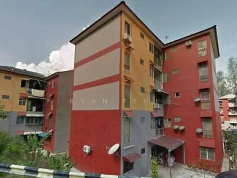 Exterior type: low-rise apartment block; features: red painted facade, cream painted facade, balconies with railings, multiple air conditioning units visible, satellite dish on roof, awnings over entrance, landscaped area in front, two-storey building, surrounded by greenery; style: modern.
