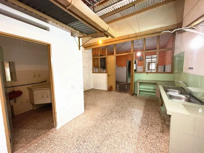 Kitchen features: green tiled backsplash, double-bowl stainless-steel sink, wooden cabinetry, exposed beams on ceiling, mosaic tile flooring, window with metal grilles, open layout, light fixture, countertop with storage below; style: traditional. Room features: plain white walls, doorway leading to another room, light fixture.