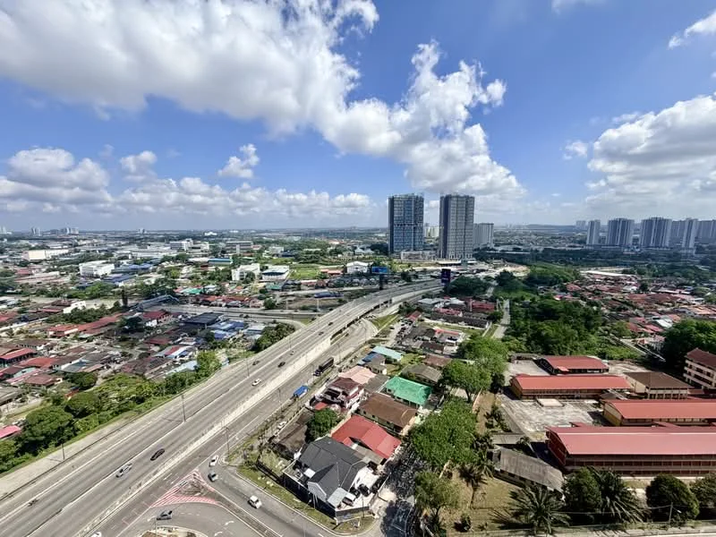 Exterior type: high-rise condominium; features: city skyline view, highway visible, urban landscape, surrounded by greenery, multiple high-rise buildings, mixed residential and commercial areas; style: modern.