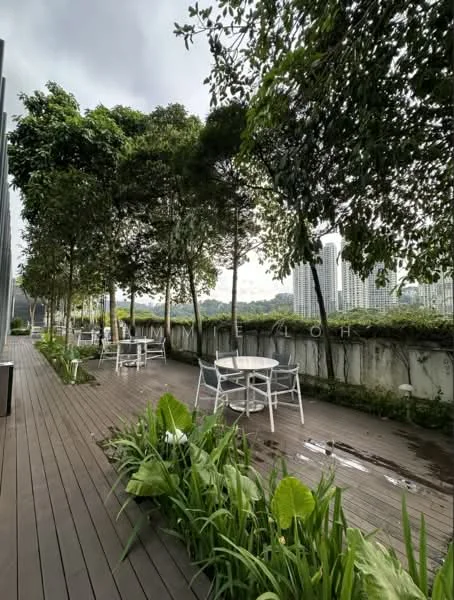 Exterior type: landscape garden; features: wooden decking, manicured garden beds, mature trees, outdoor seating area with white tables and chairs, concrete wall, view of surrounding buildings; style: modern.