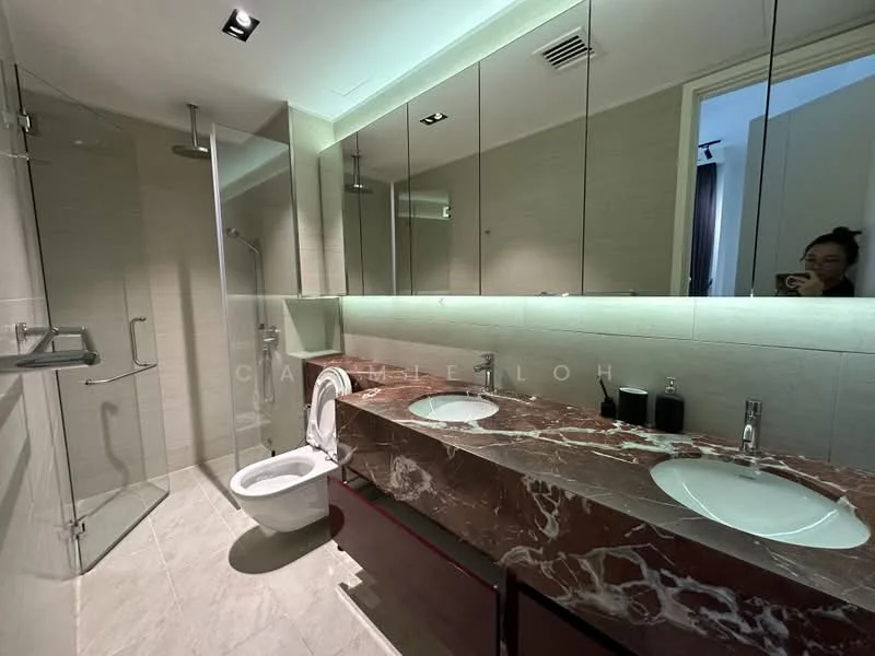 Bathroom features: double-sink vanity with marble top, chrome basin mixer faucets, framed mirror, one-piece toilet, walk-in shower with glass enclosure, rain shower head, tile cladding on walls, marble tile flooring, recessed LED downlights; style: modern.