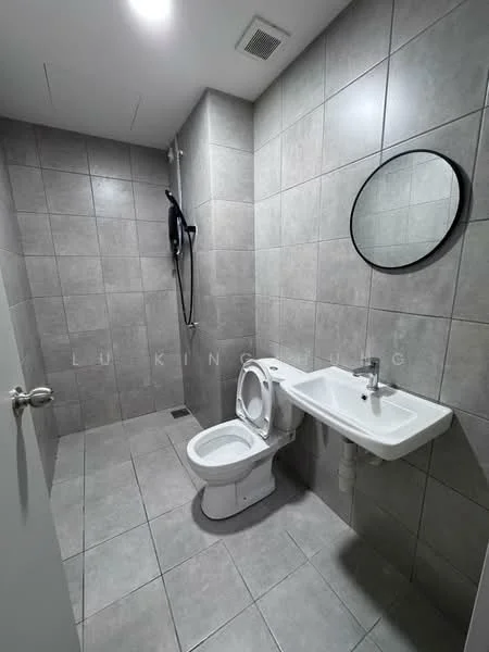 Bathroom features: grey ceramic tile flooring, grey tile walls, one-piece toilet, wall-mounted sink, round framed mirror, shower with handheld showerhead, shower wall with tile cladding, exhaust fan, recessed lighting; style: modern.