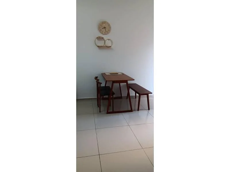 Dining features: wood dining table, wood bench seating, black upholstered chair, white walls, glossy tile flooring, decorative wall clock, minimalist decor; style: modern.