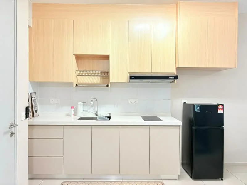 Kitchen features: light wood cabinetry, white countertop, single-bowl stainless-steel sink, chrome pull-down faucet, built-in oven, stainless-steel range hood, black fridge, ceramic tile flooring, wall-mounted dish rack, white tiled backsplash, kitchen island with storage, under-cabinet lighting; style: modern.