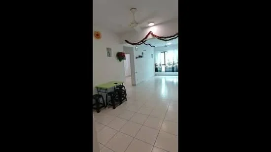 Room features: white painted walls, glossy tile flooring, ceiling fan, decorative wall hangings, green table with chairs, open layout, natural light from windows, decorative garland; style: modern; view: garden.