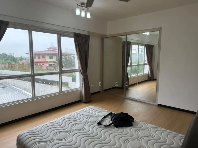 Bedroom features: large floor-to-ceiling windows, grey curtains, wooden flooring, mirror sliding wardrobe, ceiling fan with light, unmade bed with mattress, neutral wall color, view of outdoor greenery; style: modern; view: garden.