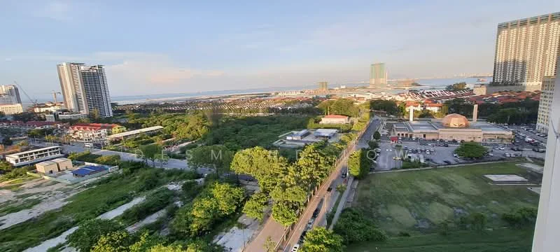 Exterior type: high-rise condominium; features: city skyline view, surrounded by greenery, adjacent to commercial buildings, visible waterfront, open space with grass, urban landscape, multiple high-rise buildings, roadway visible in foreground; style: modern.