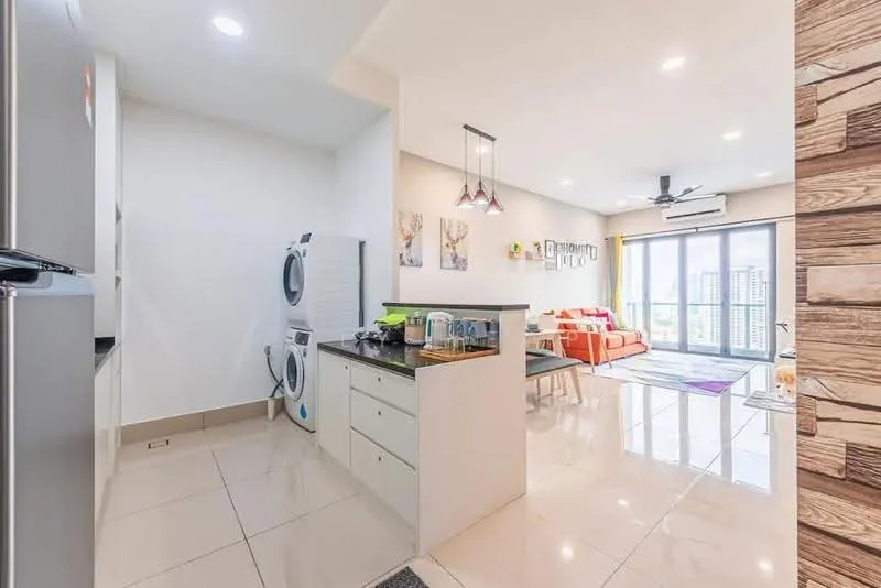 Kitchen features: white cabinetry, black countertop, stainless-steel fridge, built-in oven, 4-burner gas hob, single-bowl stainless-steel sink, chrome pull-down faucet, tile flooring, recessed downlights; style: modern. Living features: 3-seater fabric sofa in orange, coffee table, area rug with geometric pattern, wall-mounted TV, floor-to-ceiling windows, curtains, ceiling fan; style: modern; view: city. Laundry features: stacked washer and dryer, white cabinetry.