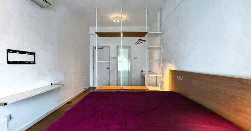 Bedroom features: queen-size bed with purple bedding, wooden headboard, white painted walls, wooden flooring, built-in wardrobe with sliding doors, open shelving unit, hanging clothes rack, ceiling light fixture, window with natural light, door leading to hallway; style: modern.