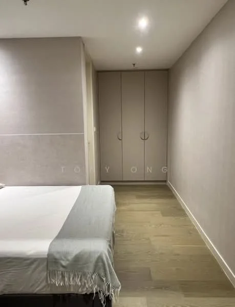 Bedroom features: queen-size bed, light grey bedspread, wooden flooring, built-in wardrobe with sliding doors, neutral painted walls, recessed ceiling lights, minimalist decor, no visible window treatments; style: modern.
