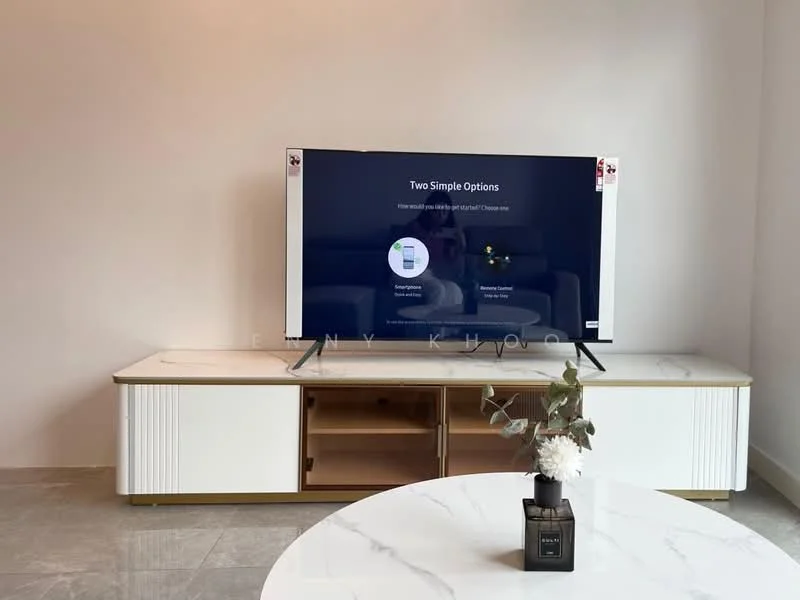 Living features: large flat-screen TV on stand, white TV console with gold accents, marble-top coffee table, grey tile flooring, decorative plant on coffee table, minimalist decor, neutral wall color, open space layout; style: modern.
