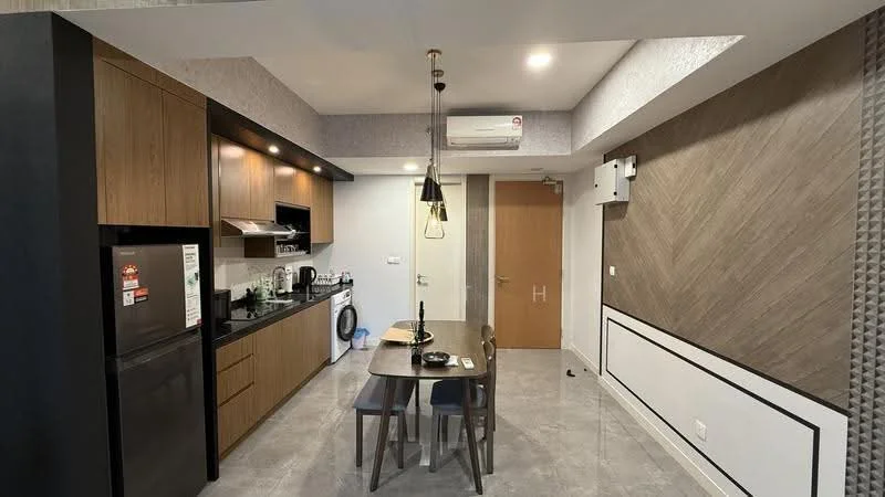 Kitchen features: brown wooden cabinetry, black countertop, stainless-steel fridge, built-in oven, 4-burner gas hob, white ceramic sink, chrome pull-down faucet, washing machine, pendant light fixture, recessed downlights, grey tiled flooring, wall-mounted split AC; style: modern. Dining features: wooden dining table for two, two dining chairs; style: modern.