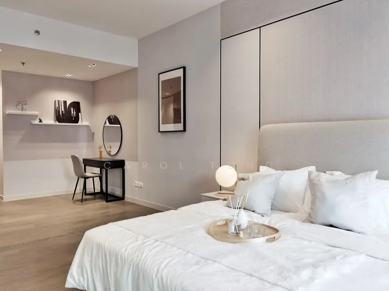 Bedroom features: king-size bed with upholstered headboard, white bedding, wooden bedside table, decorative tray on bed, wall-mounted artwork, floor-to-ceiling windows, light wood flooring, desk with chair, round mirror, shelf with decorative items, recessed lighting, neutral painted walls; style: modern.