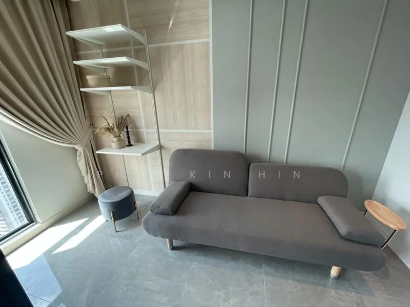 Living features: grey fabric sofa, wooden side table, round stool, floor-to-ceiling window, sheer curtains, light grey marble flooring, wood panel accent wall, decorative shelving unit; style: modern; view: city.
