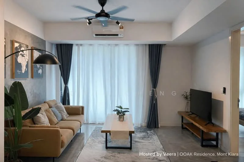 Living features: 3-seater fabric sofa in beige, wooden coffee table, wall-mounted TV, floor lamp with black shade, 5-blade ceiling fan with light, recessed downlights, light grey wall, white painted walls, floor-to-ceiling windows with sheer curtains, grey area rug, decorative plant in ceramic pot; style: modern.
