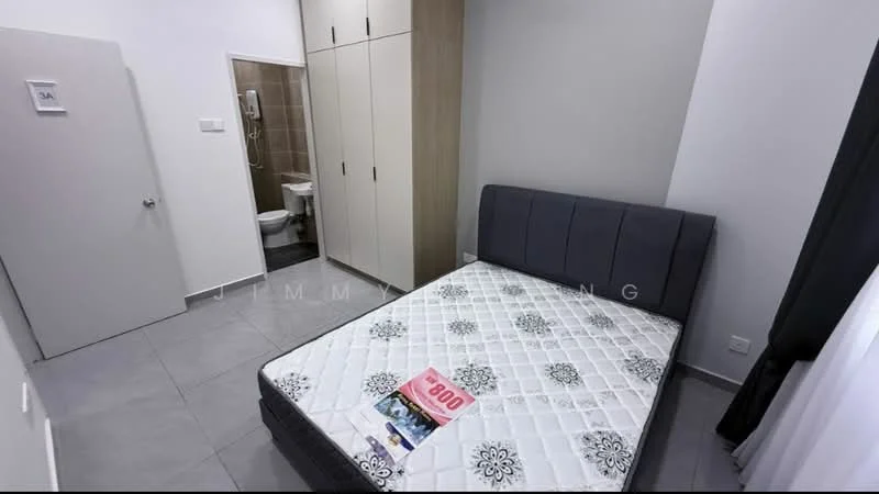 Bedroom features: queen-size bed with grey upholstered headboard, white mattress with floral pattern, grey tiled flooring, built-in wardrobe with wood finish, white painted walls, window with sheer curtains, door leading to bathroom, decorative wall art, area rug with geometric pattern; style: modern. Bathroom features: toilet, sink with chrome basin mixer, shower with glass enclosure, tile cladding on walls, light fixture, mirror, grey tiled flooring; style: modern.