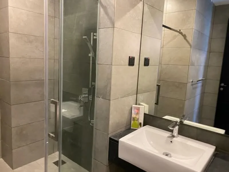 Bathroom features: glass shower enclosure, rain shower head, handheld shower, single-sink vanity with white cabinet, chrome basin mixer, grey tiled walls, grey tiled flooring, mirror above vanity, toilet, towel bar, wall-mounted lighting; style: modern.