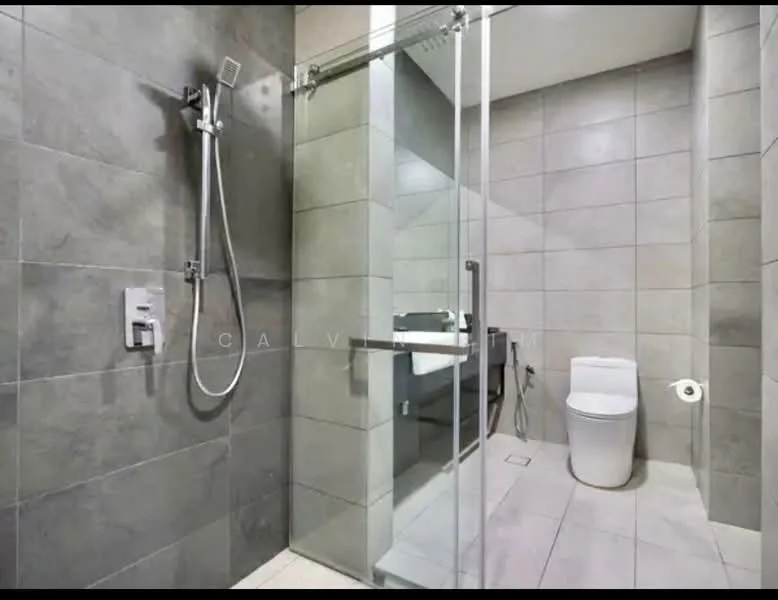 Bathroom features: walk-in shower with glass enclosure, rain shower head, handheld shower, chrome basin mixer, one-piece toilet, grey tile cladding on walls, light-colored tile flooring, vanity with sink, mirror above vanity, toilet paper holder; style: modern.
