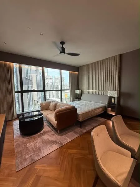 Bedroom features: king-size bed, upholstered headboard, 2 bedside lamps, 3-seater fabric sofa in beige, coffee table, area rug with geometric pattern, floor-to-ceiling windows, city view, wooden flooring, 5-blade ceiling fan with light, wall-mounted TV, built-in wardrobe, decorative wall paneling; style: modern; view: city.