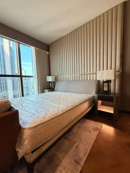 Bedroom features: king-size bed, upholstered headboard, bedside lamps, nightstand, floor-to-ceiling windows, curtains, wooden flooring, decorative area rug, textured wall paneling; style: modern; view: city.