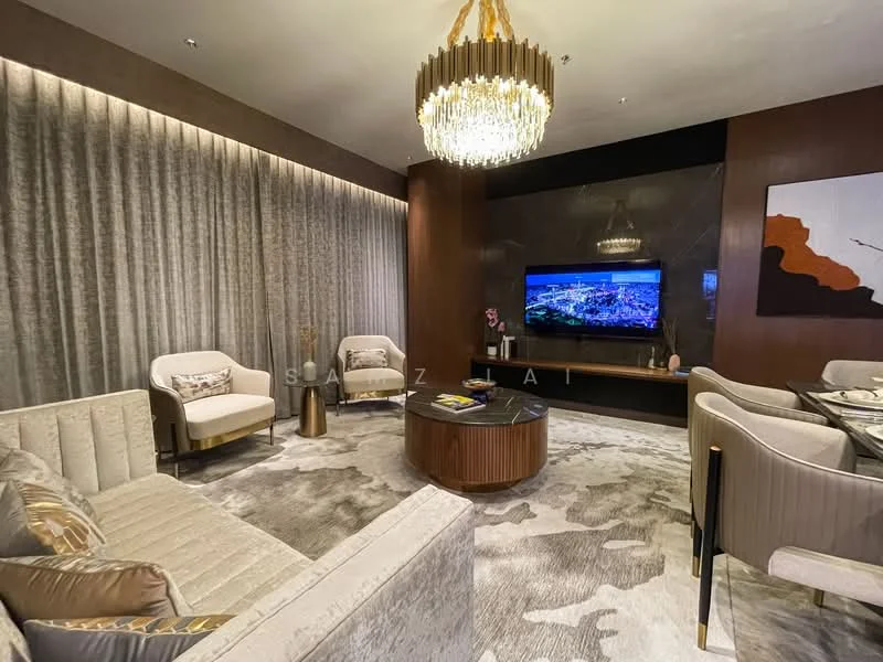 Living features: 3-seater fabric sofa in cream, 2 armchairs in white, round coffee table with wooden base, wall-mounted TV, chandelier with crystals, textured wall with grey curtains, decorative wall art, area rug with abstract pattern, wood paneling on feature wall, recessed lighting; style: modern.