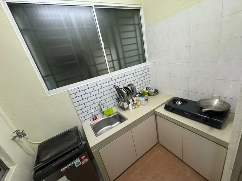 Kitchen features: single-bowl stainless-steel sink, chrome pull-down faucet, white tiled backsplash with brick pattern, light beige laminate cabinetry, countertop with light color, built-in gas hob, stainless-steel frying pan, black refrigerator, window with metal grilles, kitchen utensils on countertop, dish soap and cleaning supplies, open shelving for dishes; style: modern.
